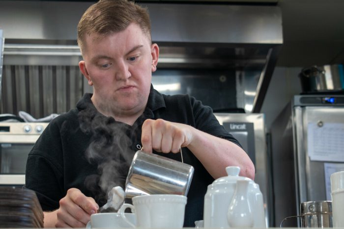 Man working as a barista.