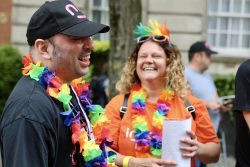 Two people smiling at event