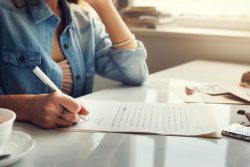 caucasian-woman-writing-letter_compressed